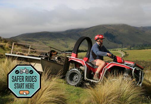Farmer driving quad bike with crush protection device installed.