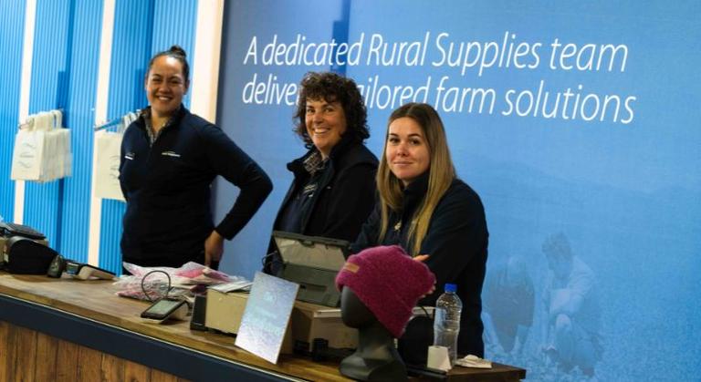 Three members of the PGW retail team ready to assist customers at checkout with their purchases.