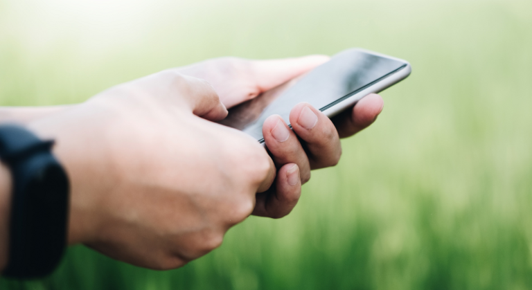 close-up of hands holding a smartphone