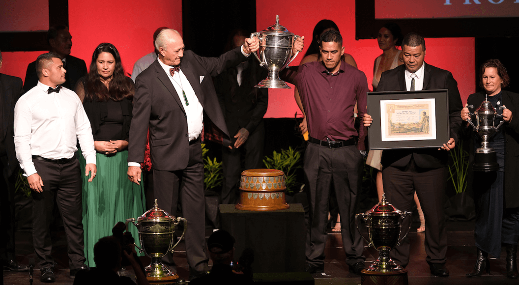Ahuwhenua Trophy 2021 winners holding up trophy