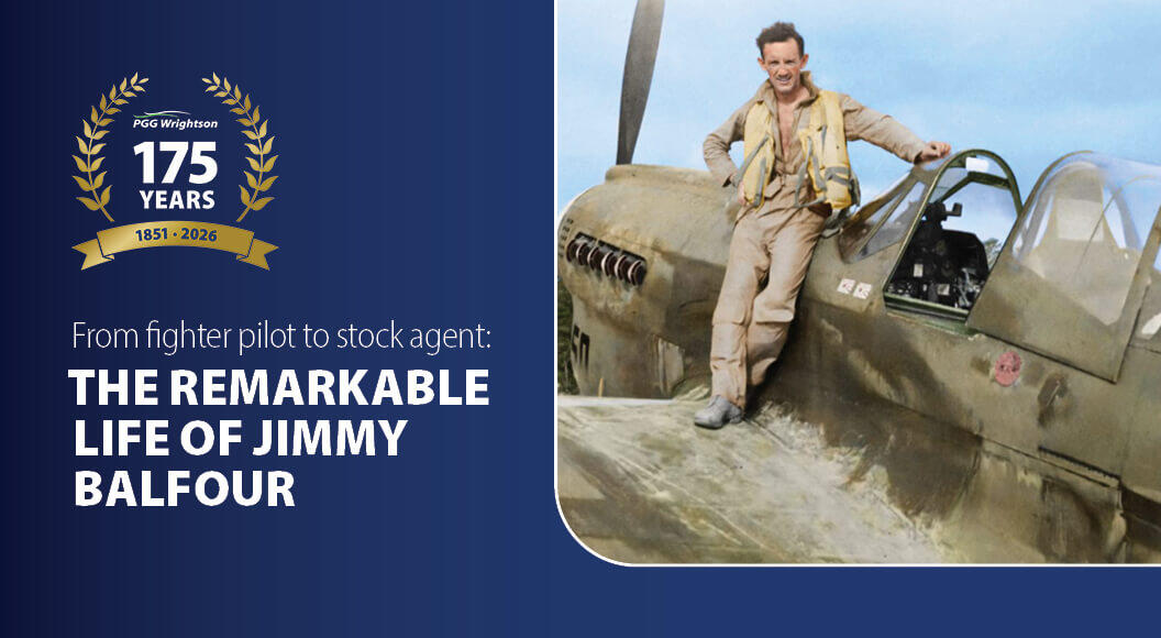 A figher pilot standing in th ecockpit of a plane