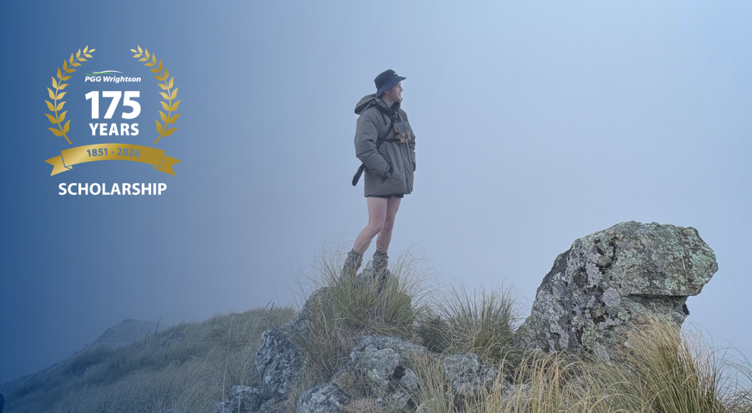 Hamish Shaw, recipient of PGW 175 Year Scholarship, standing on a mountaintop.